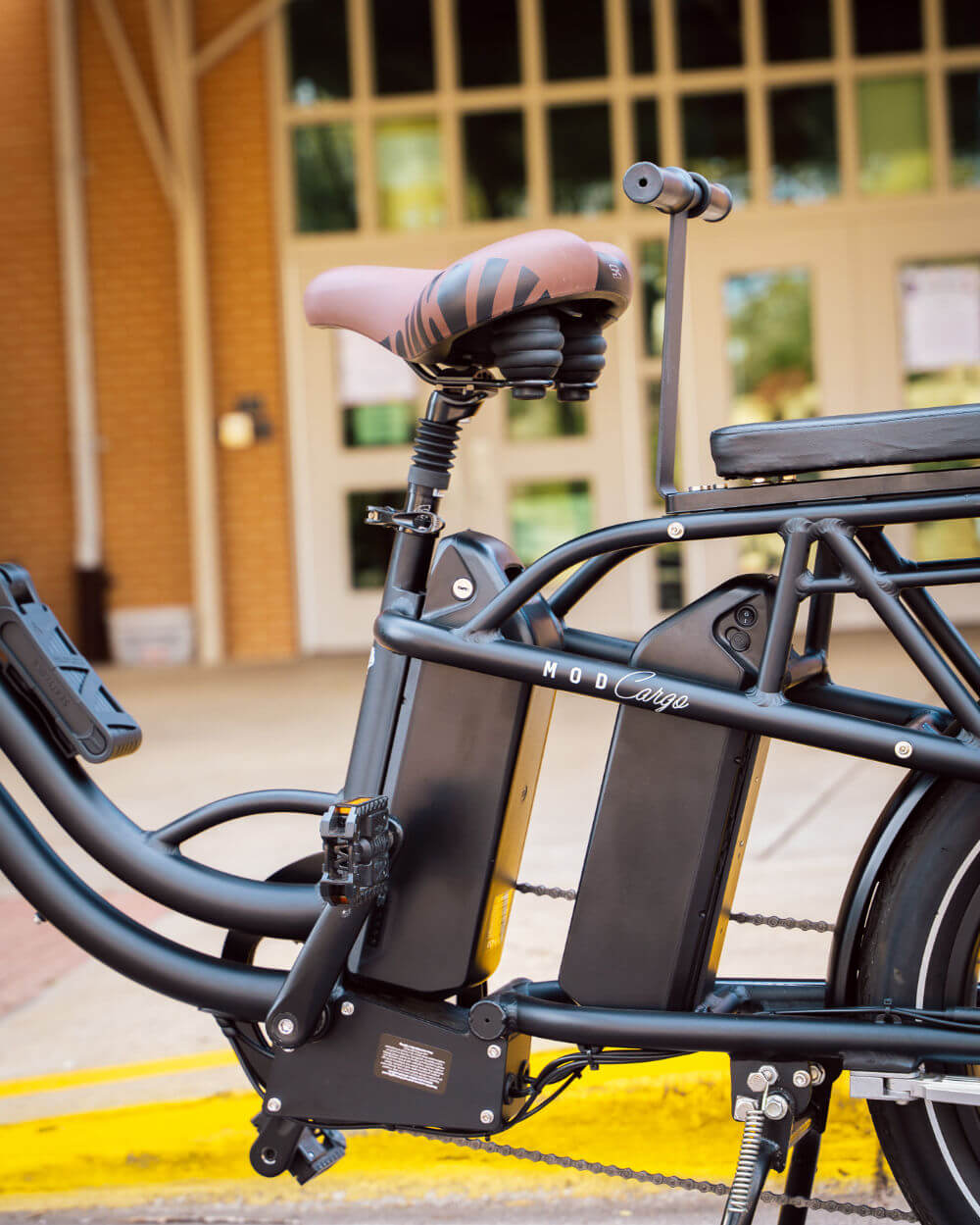 Side view of MOD CarGo 3 hauler bike with extended Snap-On rack and optional dual battery feature for heavy loads and transport.