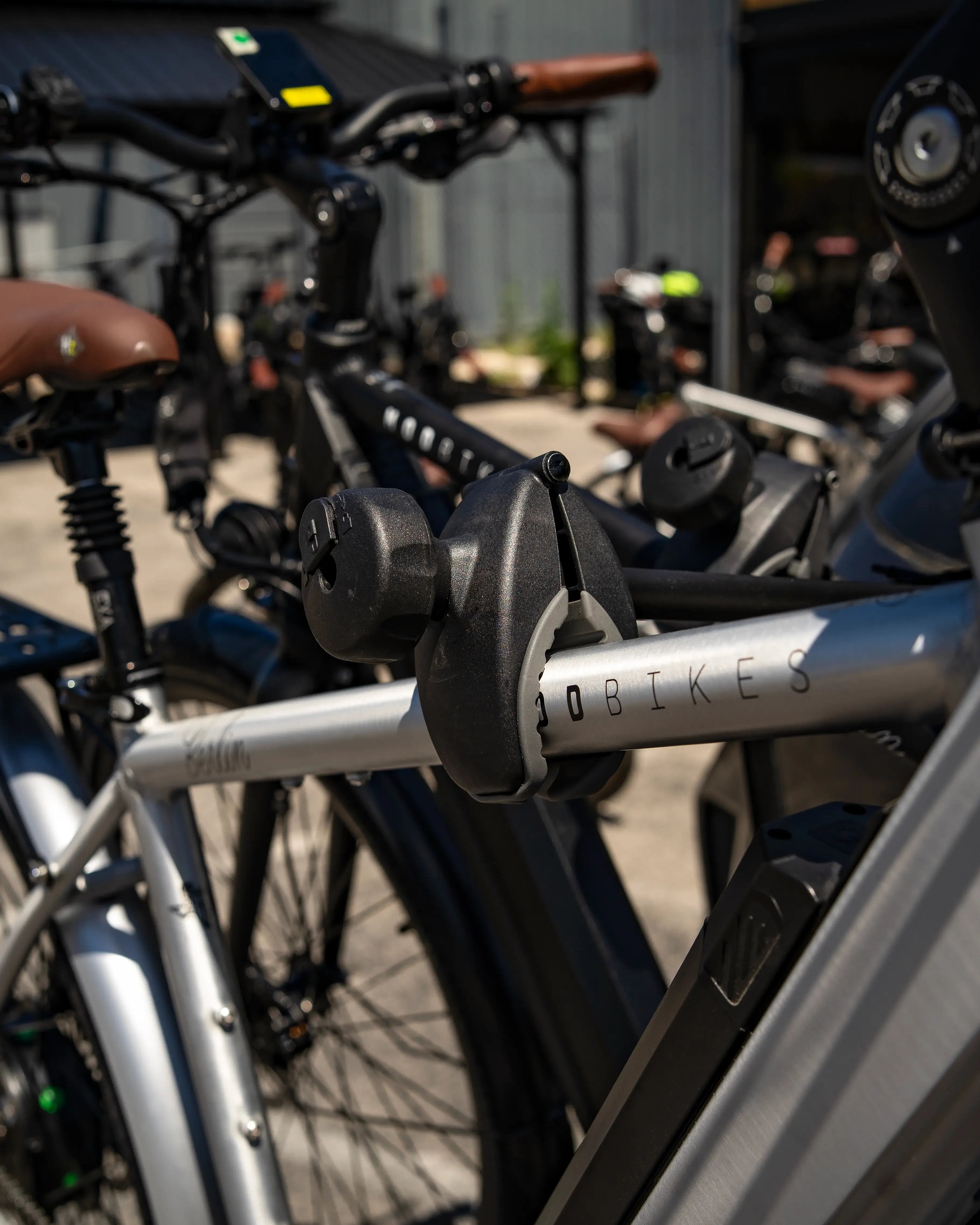 Close-up of bikes secured on the Hollywood Destination E-Bike Rack, showcasing durable grips and sturdy construction for safe transport.
