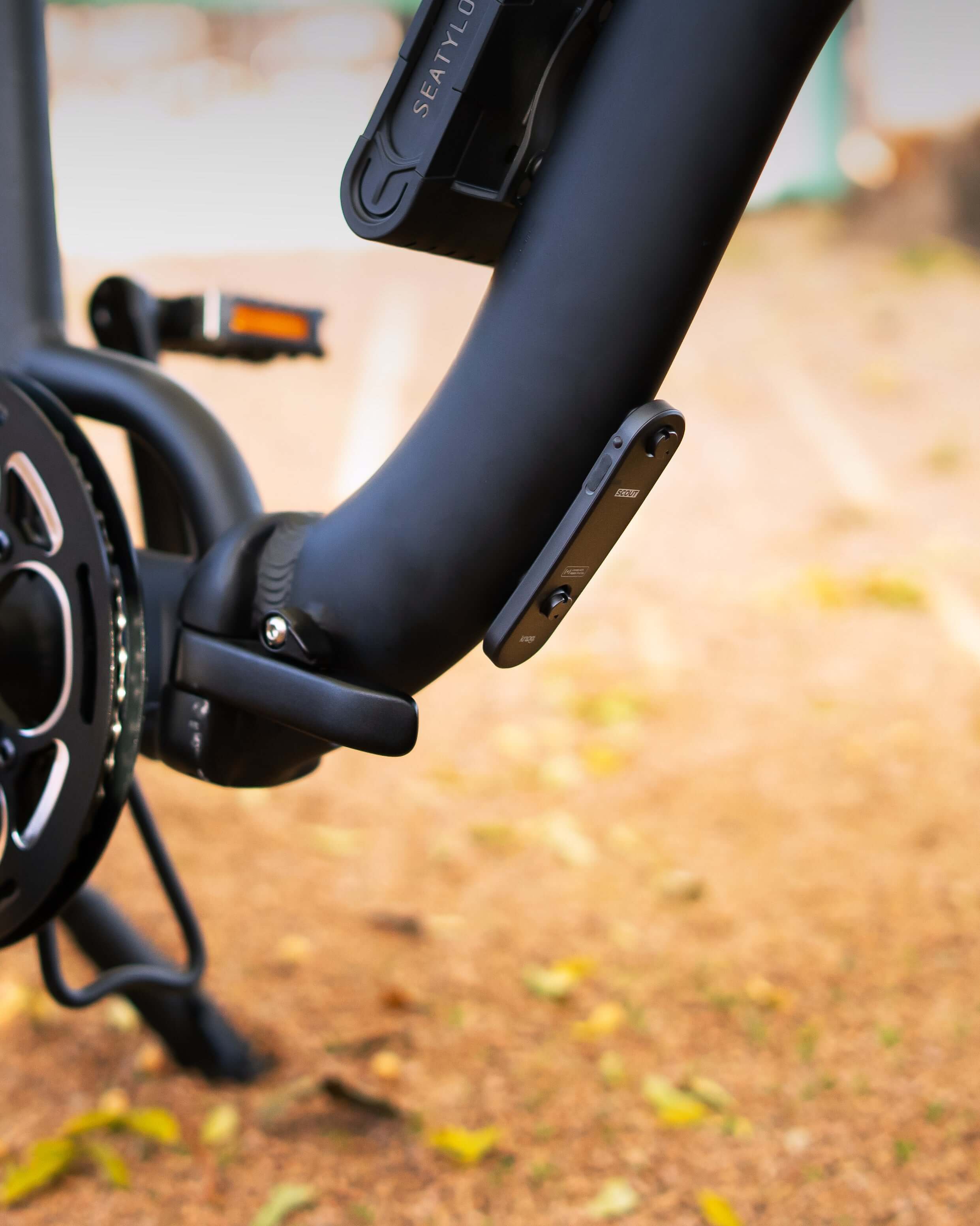 Discreetly mounted Bike Alarm & Finder on a bicycle frame, offering 85dB theft deterrence and Apple Find My app tracking, enhances bike security.