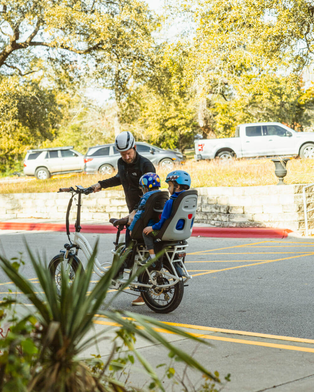 MOD CarGo 3 bike with extended Snap-On rack carrying two children, showcasing sturdy design ideal for passengers and heavy loads.